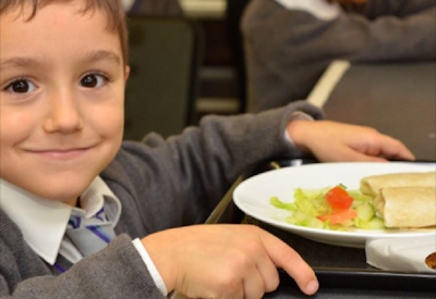 child holding tray